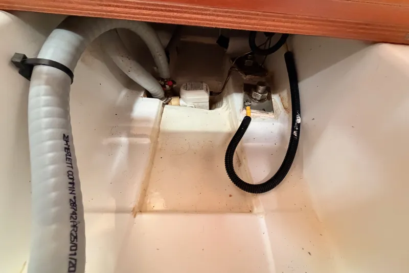 Slide: The Image of Bilge area of 2017 Beneteau Oceanis 41.1 sailboat with hoses and fittings. - 107