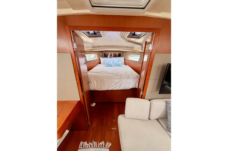 Slide: The Image of Interior of 2017 Beneteau Oceanis 41.1 yacht with cozy bedroom and wooden finish. - 96