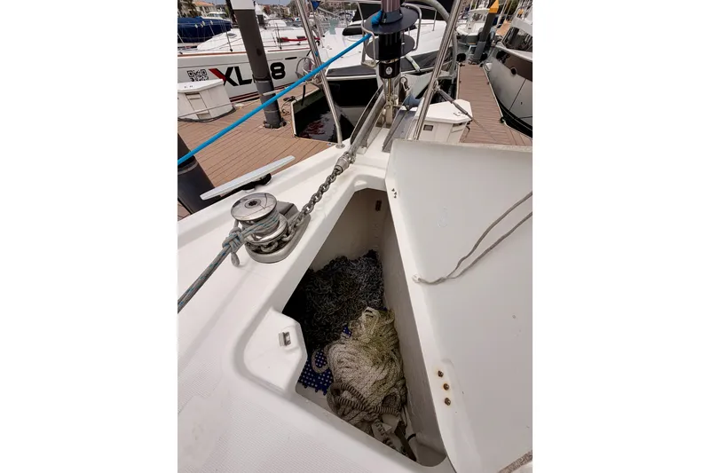 Slide: The Image of Beneteau Oceanis 41.1 (2017) anchor locker with chain and rope on deck. - 19