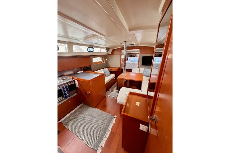 Slide: The Image of Interior of 2017 Beneteau Oceanis 41.1 yacht, featuring elegant wood finishes and modern design. - 83