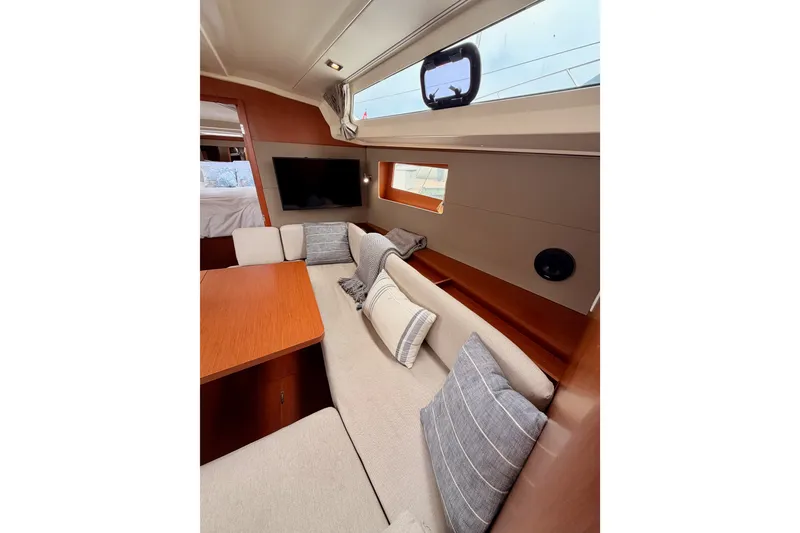 Slide: The Image of Interior of 2017 Beneteau Oceanis 41.1 yacht with cozy seating and modern decor. - 86