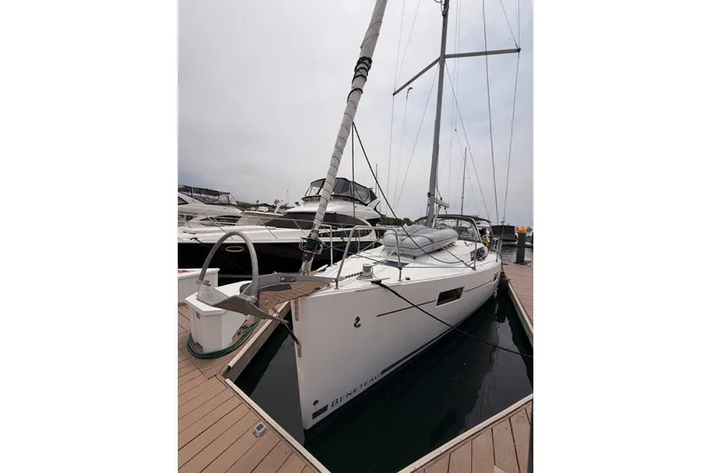 Slide: The Image of 2017 Beneteau Oceanis 41.1 sailboat docked at marina, overcast sky. - 1
