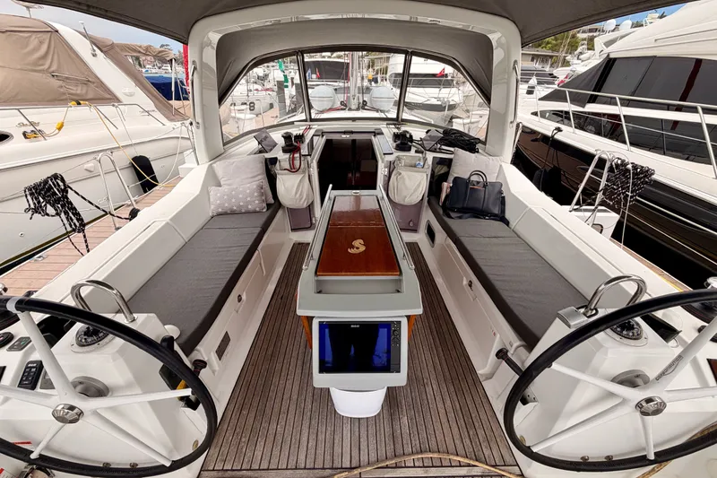 Slide: The Image of 2017 Beneteau Oceanis 41.1 yacht cockpit with dual steering wheels and comfortable seating. - 50