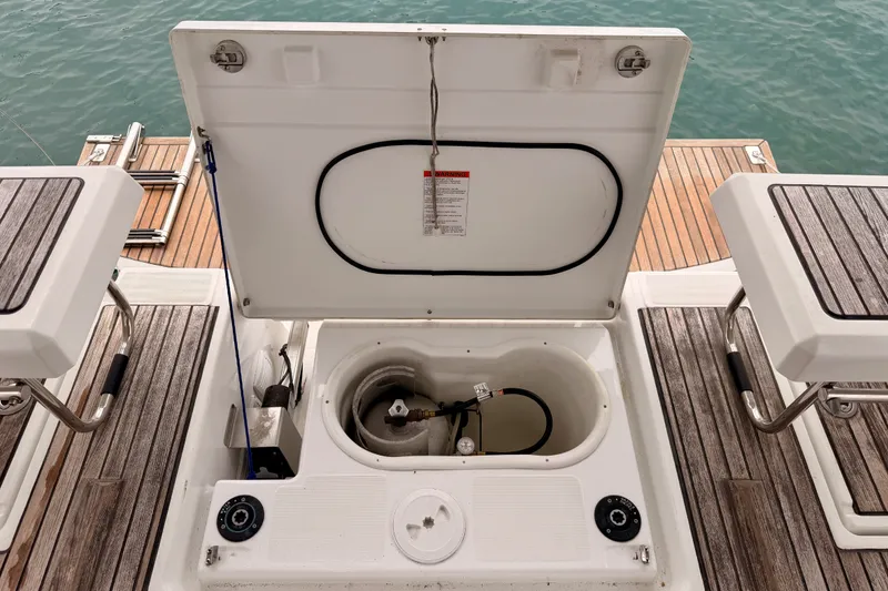 Slide: The Image of Open storage compartment on 2017 Beneteau Oceanis 41.1 yacht deck, revealing interior components. - 31