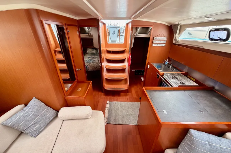 Slide: The Image of Interior of 2017 Beneteau Oceanis 41.1 yacht with modern kitchen and cozy seating area. - 105