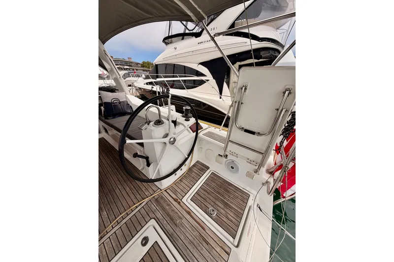 Slide: The Image of Cockpit of 2017 Beneteau Oceanis 41.1 sailboat with wooden deck and steering wheel. - 43
