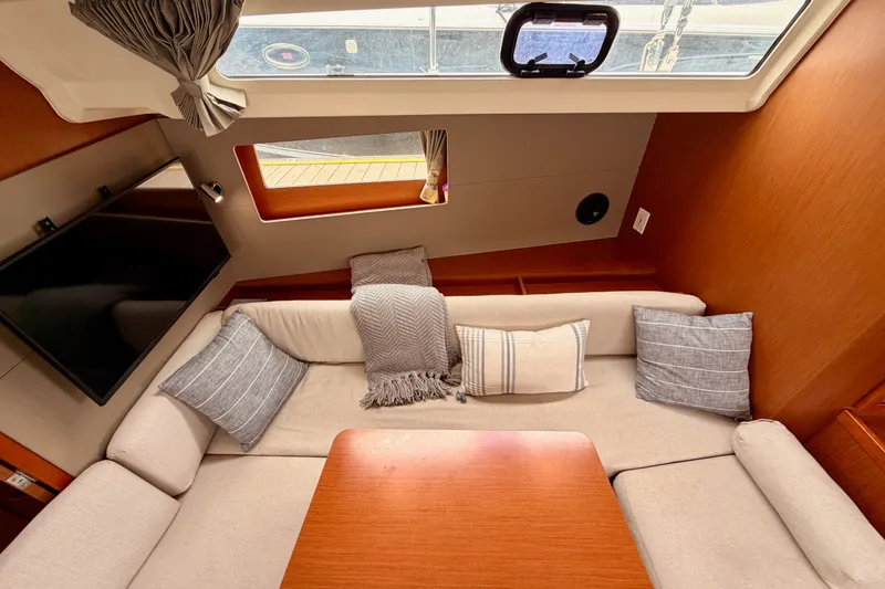 Slide: The Image of Interior of 2017 Beneteau Oceanis 41.1 yacht with cozy seating and cushions. - 89