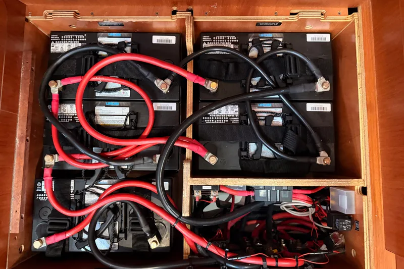 Slide: The Image of Battery compartment of a 2017 Beneteau Oceanis 41.1 sailboat with red and black cables. - 72