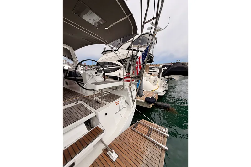 Slide: The Image of 2017 Beneteau Oceanis 41.1 sailboat docked, showcasing cockpit and helm area. - 33