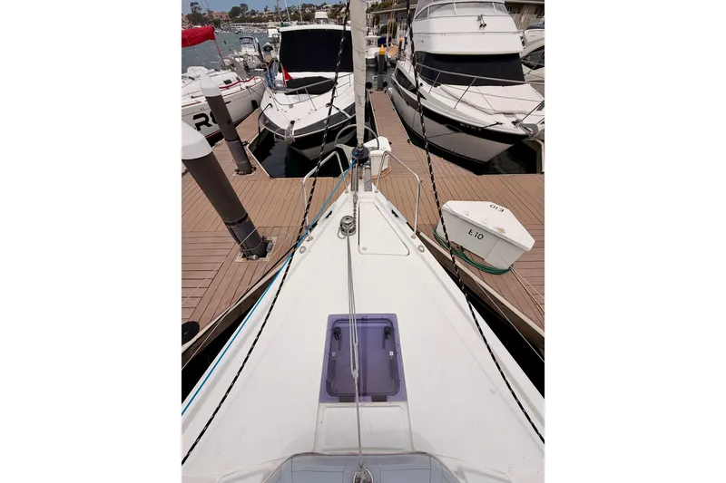 Slide: The Image of 2017 Beneteau Oceanis 41.1 sailboat docked at marina, surrounded by other boats. - 18