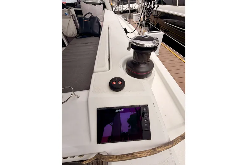 Slide: The Image of 2017 Beneteau Oceanis 41.1 yacht deck with winch and navigation display. - 47