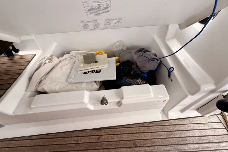 Slide: The Image of Storage compartment on a 2017 Beneteau Oceanis 41.1 sailboat with various items inside. - 53