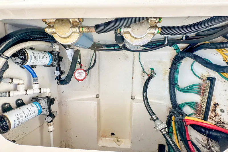 Slide: The Image of 2018 Pursuit C 260 Center Console boat wiring and plumbing system. - 54