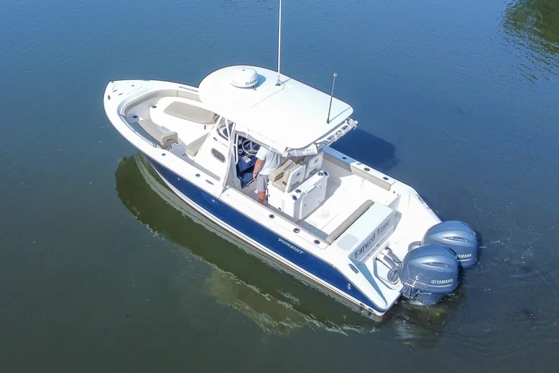 Slide: The Image of 2018 Pursuit C 260 Center Console boat on calm water, aerial view. - 21