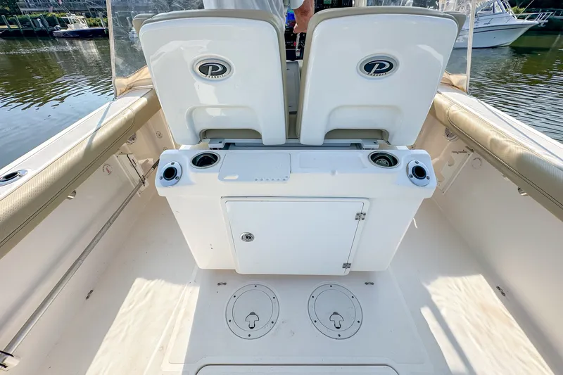 Slide: The Image of 2018 Pursuit C 260 Center Console boat interior with seating and storage compartments. - 42