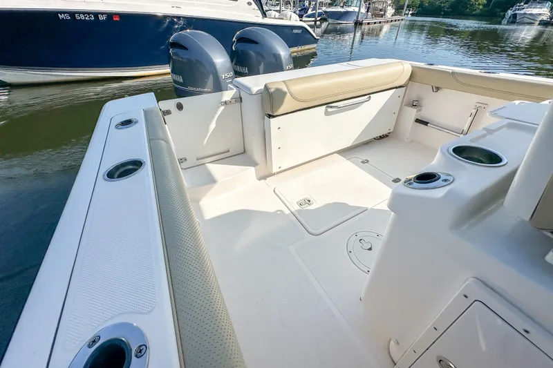 Slide: The Image of 2018 Pursuit C 260 Center Console boat interior with twin Yamaha engines. - 48