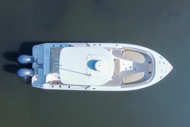 Slide: The Image of Overhead view of a 2018 Pursuit C 260 Center Console boat on water. - 24
