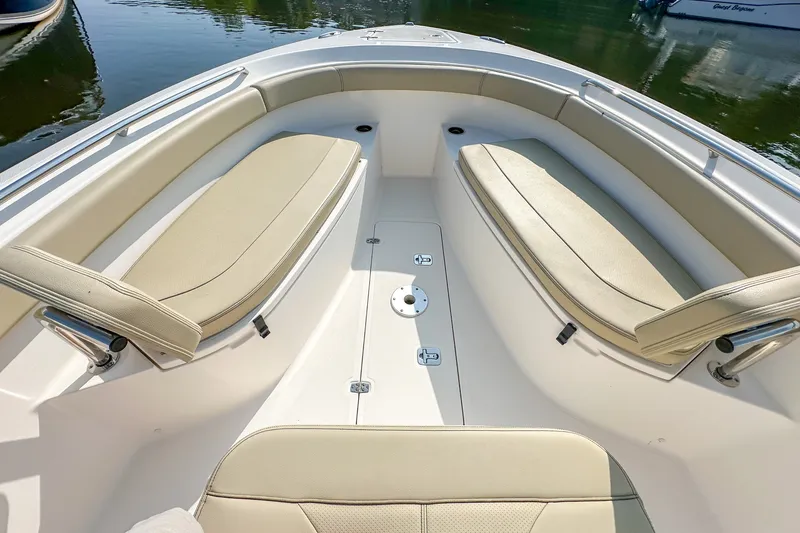 Slide: The Image of 2018 Pursuit C 260 Center Console boat interior with cushioned seating. - 34