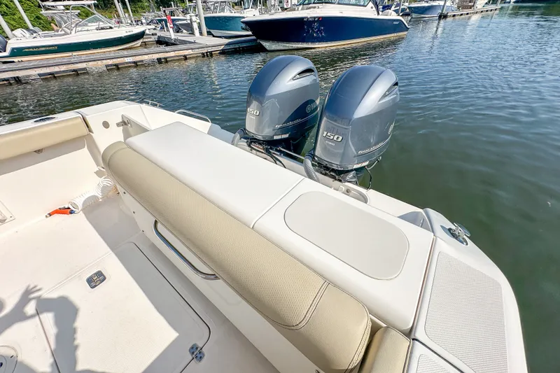 Slide: The Image of 2018 Pursuit C 260 Center Console boat with twin Yamaha 150 engines docked. - 50