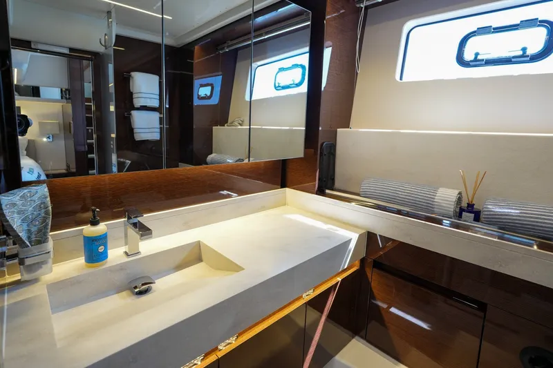 Slide: The Image of Luxurious bathroom interior of 2023 Prestige 590 yacht with modern fixtures and elegant design. - 99