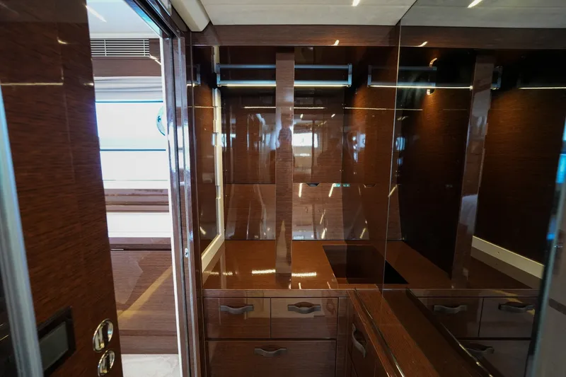 Slide: The Image of Luxurious interior of 2023 Prestige 590 yacht with sleek wood finishes and modern design. - 98