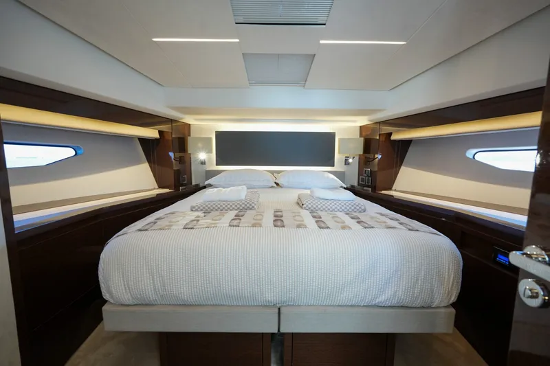 Slide: The Image of Luxurious bedroom interior of 2023 Prestige 590 yacht with modern design and elegant lighting. - 4