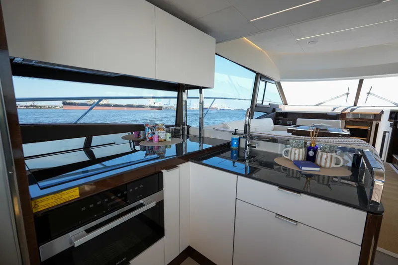 Slide: The Image of Modern kitchen interior on 2023 Prestige 590 yacht with ocean view. - 54