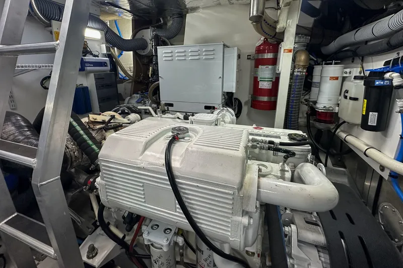 Slide: The Image of Engine room of a 2023 Prestige 590 yacht, showcasing machinery and equipment. - 102