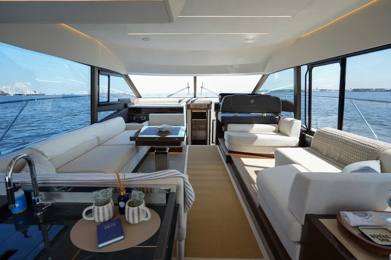 Slide: The Image of Luxurious interior of 2023 Prestige 590 yacht with elegant seating and ocean view. - 1