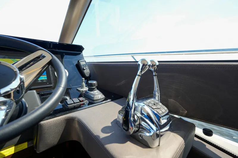 Slide: The Image of Cockpit of 2023 Prestige 590 yacht with modern controls and steering wheel. - 73