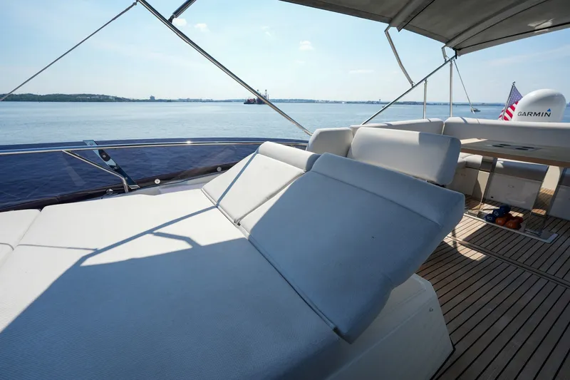 Slide: The Image of Luxurious 2023 Prestige 590 yacht deck with sun loungers and scenic ocean view. - 35