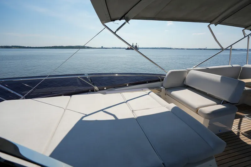 Slide: The Image of Luxurious 2023 Prestige 590 yacht deck with comfortable seating and ocean view. - 34