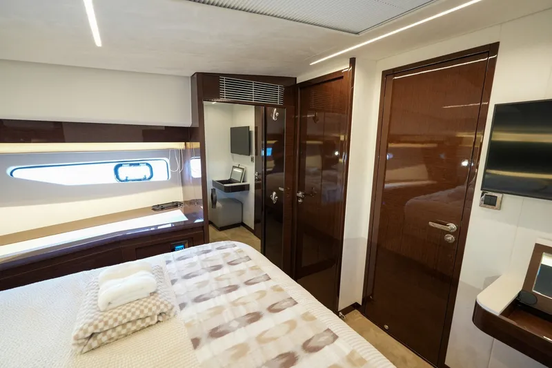 Slide: The Image of Luxurious interior of 2023 Prestige 590 yacht bedroom with modern design and elegant finishes. - 80