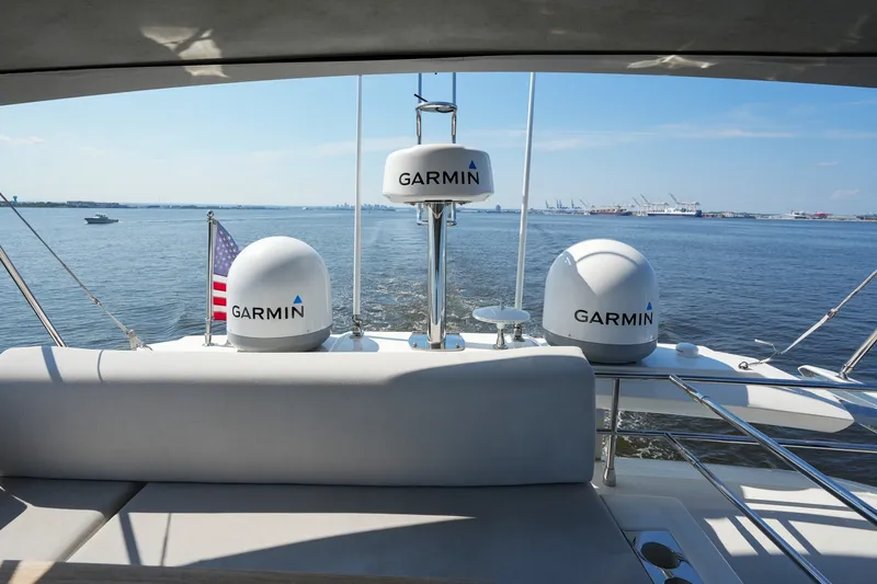 Slide: The Image of Prestige 590 yacht with Garmin equipment, cruising on a sunny day in 2023. - 43