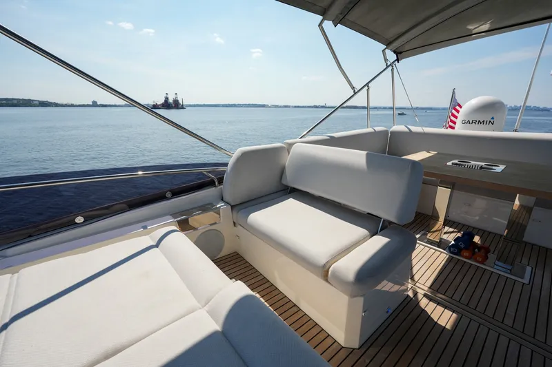 Slide: The Image of Luxurious 2023 Prestige 590 yacht deck with comfortable seating and ocean view. - 33