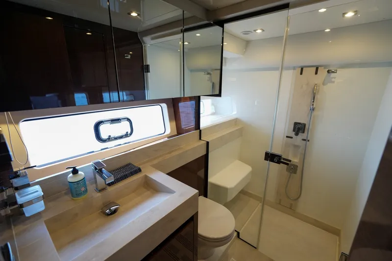 Slide: The Image of Luxurious bathroom in 2023 Prestige 590 yacht with modern fixtures and glass shower. - 81