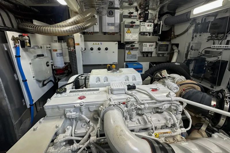 Slide: The Image of Engine room of a 2023 Prestige 590 yacht, showcasing mechanical components and control systems. - 101