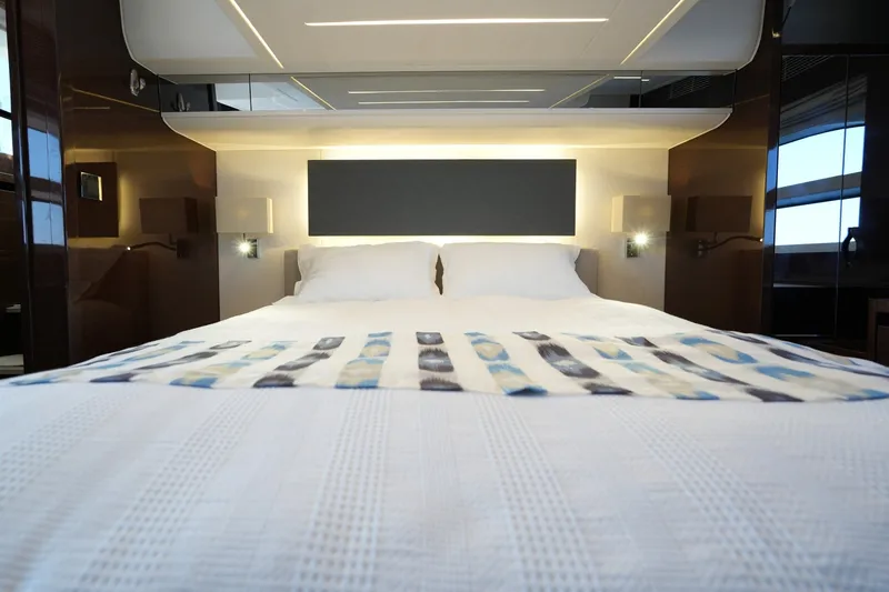 Slide: The Image of Luxurious bedroom interior of 2023 Prestige 590 yacht with modern design and elegant lighting. - 93