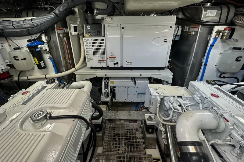 Slide: The Image of Engine room of a 2023 Prestige 590 yacht with Onan Marine generator. - 100