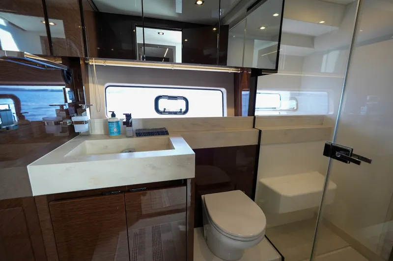 Slide: The Image of Luxurious bathroom interior of 2023 Prestige 590 yacht with modern fixtures and ocean view. - 82