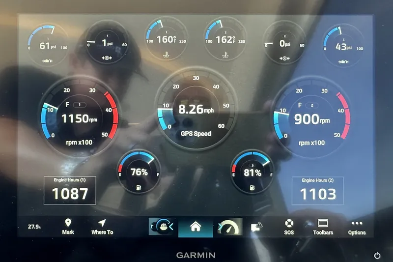 Slide: The Image of Dashboard display of a 2023 Prestige 590 yacht showing engine metrics and GPS speed. - 74