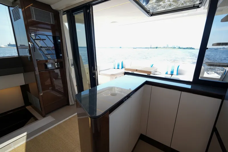 Slide: The Image of Luxurious interior of 2023 Prestige 590 yacht with ocean view and modern design. - 59