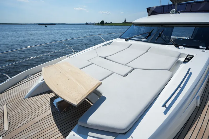 Slide: The Image of Luxurious 2023 Prestige 590 yacht with sunbathing deck and scenic water view. - 49