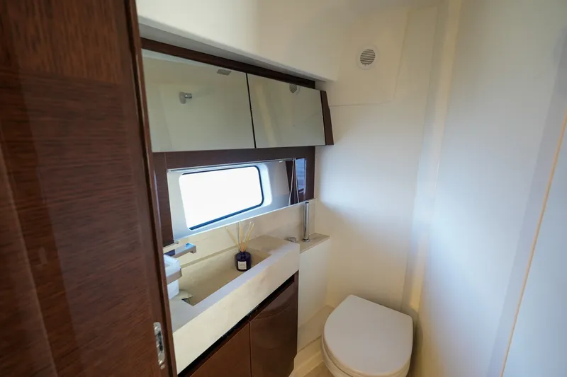 Slide: The Image of Luxurious bathroom interior of 2023 Prestige 590 yacht, featuring modern fixtures and elegant design. - 88