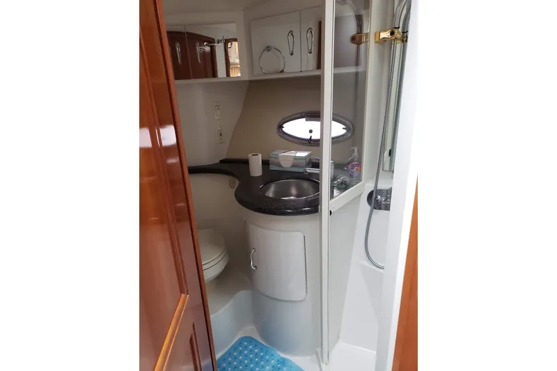 Slide: The Image of Bathroom interior of 2005 Carver 444 Cockpit Motor Yacht with sink and shower. - 11
