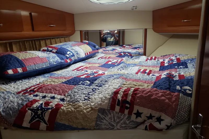 Slide: The Image of Cozy bedroom in 2005 Carver 444 Cockpit Motor Yacht with patriotic quilt bedding. - 8
