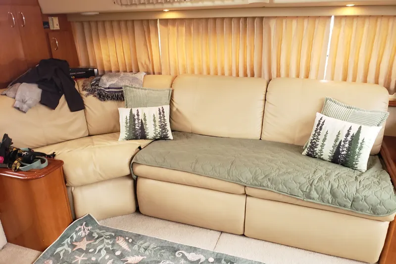 Slide: The Image of Interior of 2005 Carver 444 Cockpit Motor Yacht with beige sofa and decorative pillows. - 6