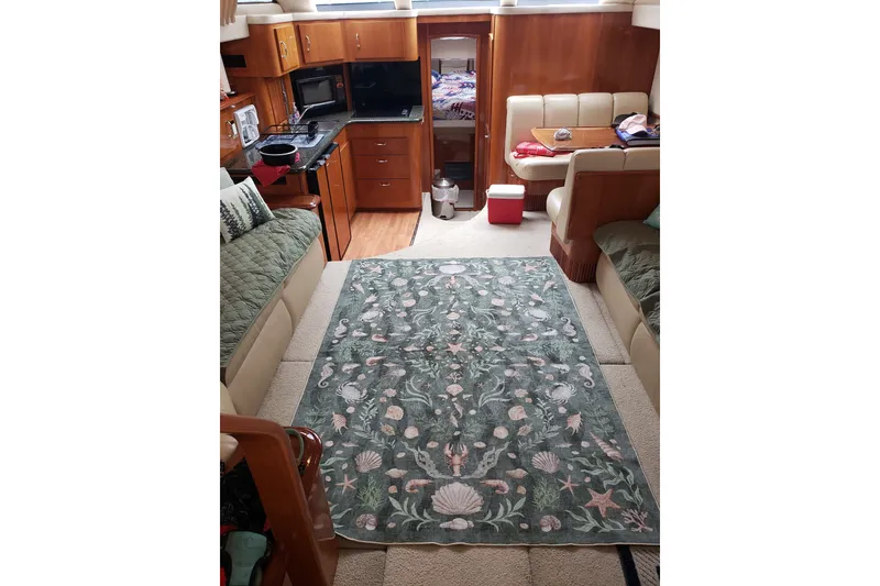 Slide: The Image of Interior of 2005 Carver 444 Cockpit Motor Yacht with kitchen and seating area. - 4