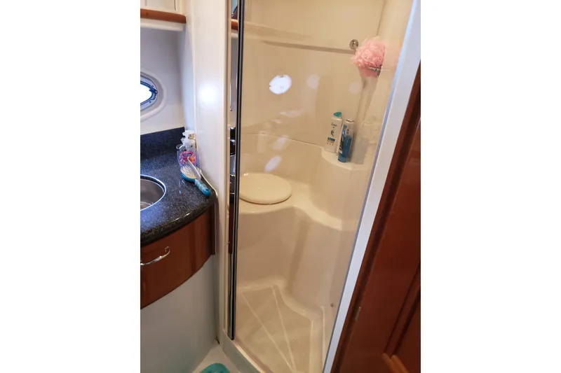 Slide: The Image of Bathroom interior of 2005 Carver 444 Cockpit Motor Yacht with shower and sink. - 10