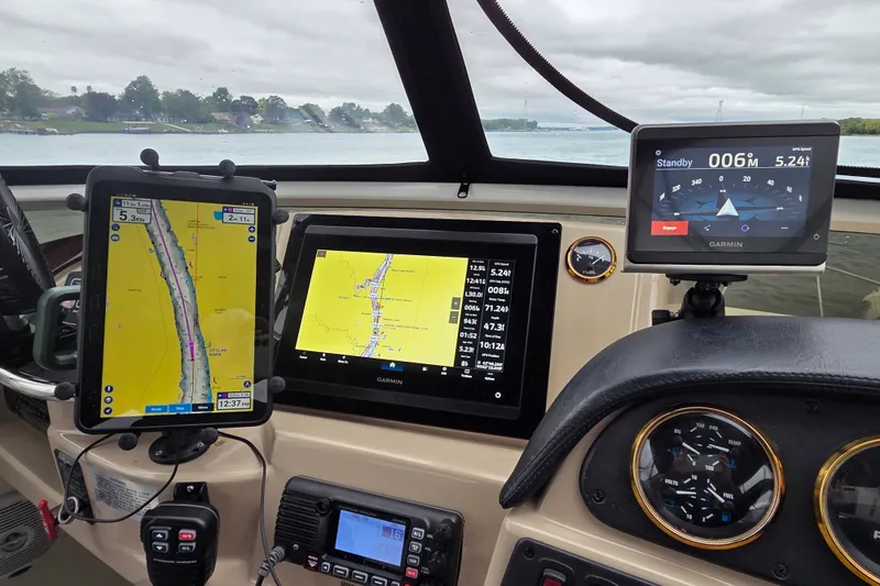 Slide: The Image of Cockpit of 2005 Carver 444 Motor Yacht with navigation displays and controls. - 3